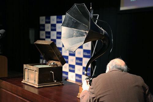 Listening to Edison's gramophone.